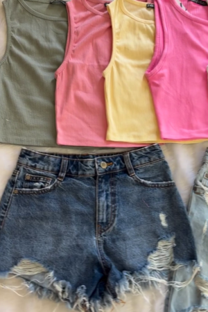 collection of ribbed crop tank tops and distressed denim shorts